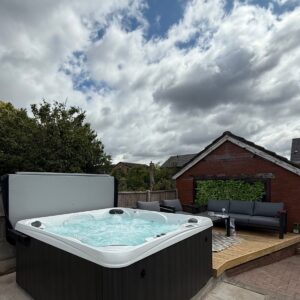 Ultimate 7 hot tub installed on a garden patio